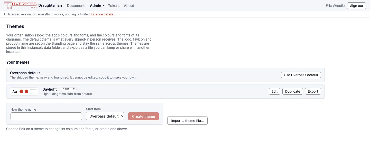 The Themes page listing the shipped Overpass default theme, marked as the default, and a custom theme called Daylight with Edit, Make default, Duplicate, Export and Delete buttons, plus a form to create a theme and an Import a theme file button.